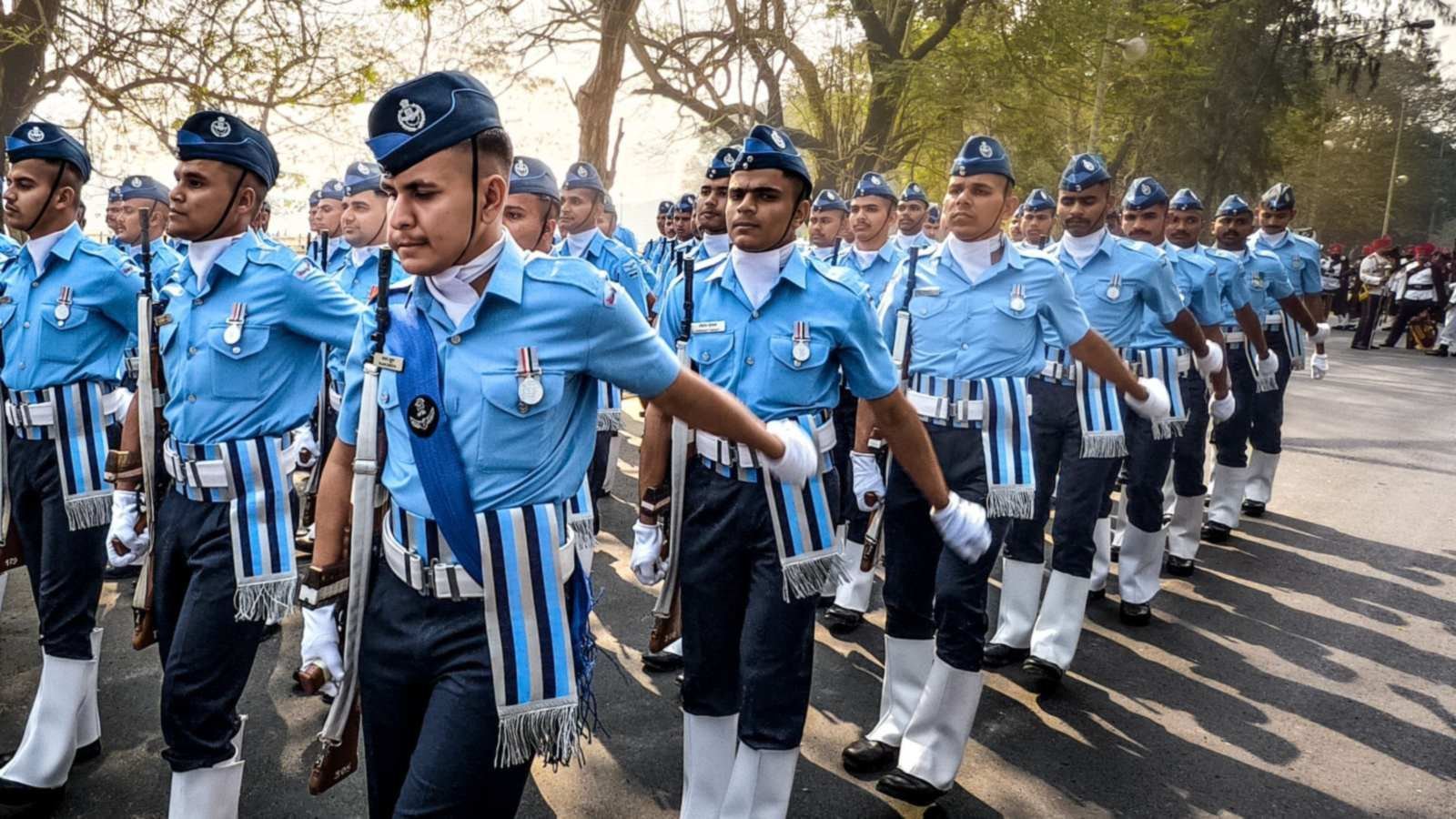Cadets in light-blue uniforms marching in formation